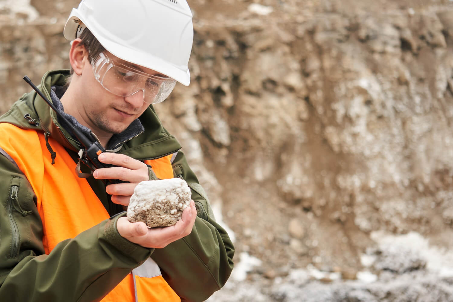 man-geologist-examines-mineral-sample man-geologist-examines-mineral-sample